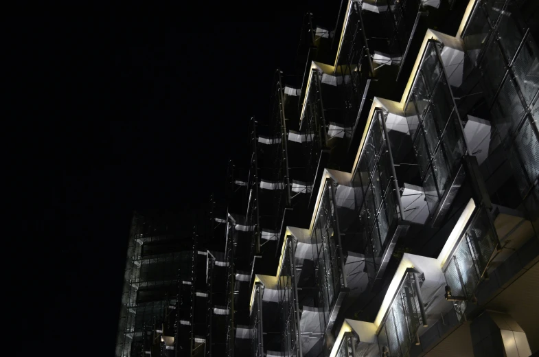 a night view of an illuminated building, with the light on it