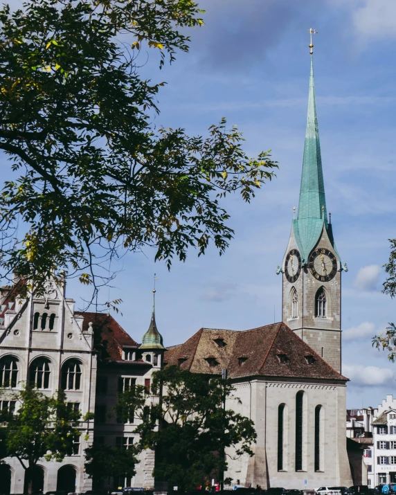 a church with a steeple and a large clock tower