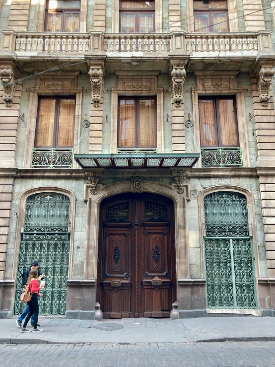 the entrance to a building with a wooden door