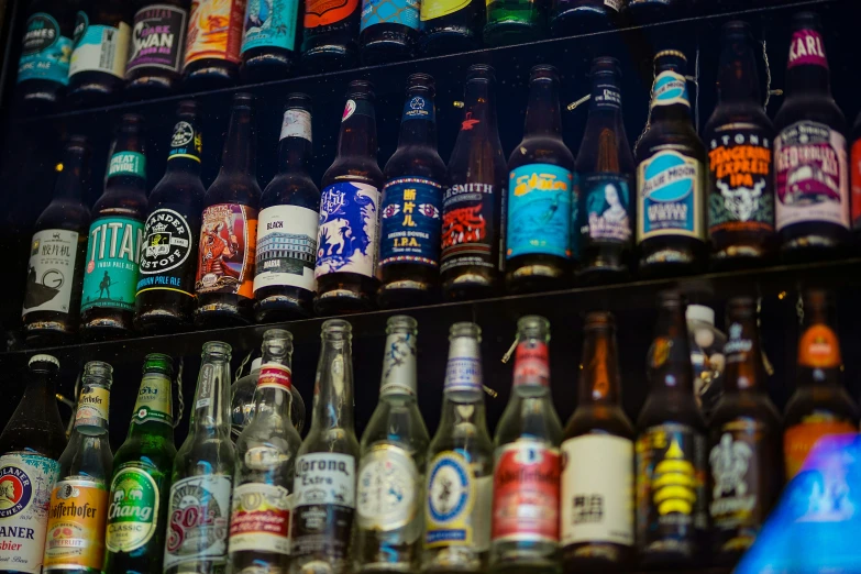 a bunch of beers are arranged neatly in a cooler