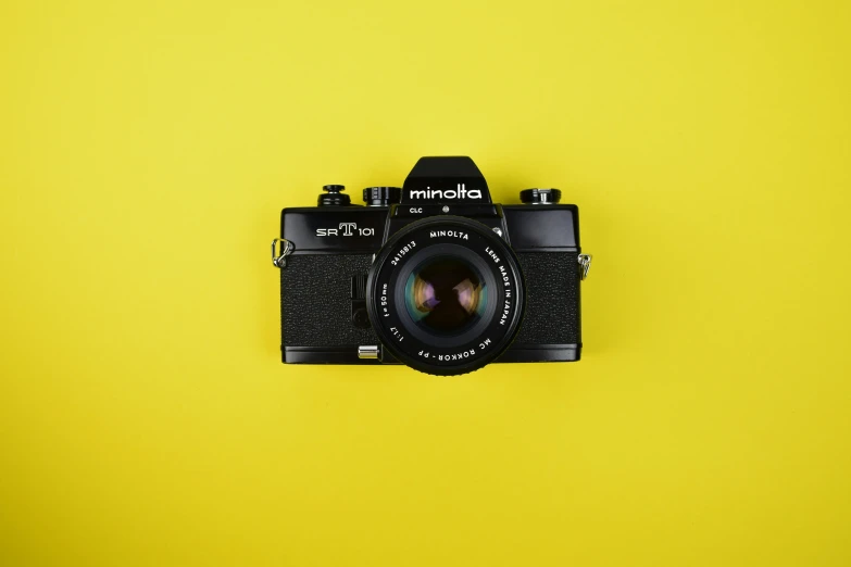 an old po of a camera on a yellow background