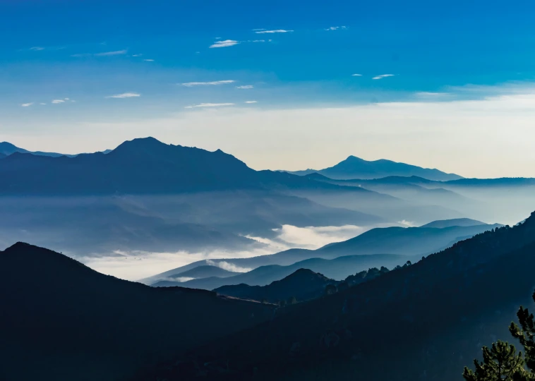 the view of the mountains and valleys in the distance