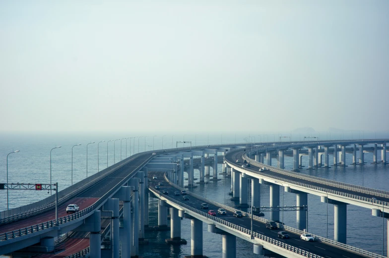 the view from inside a train window shows multiple highway bridges