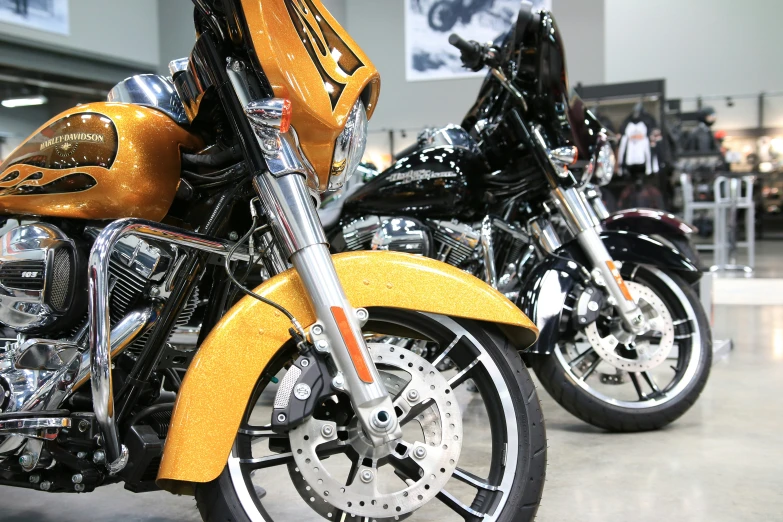 two motorcycles are parked in the showroom