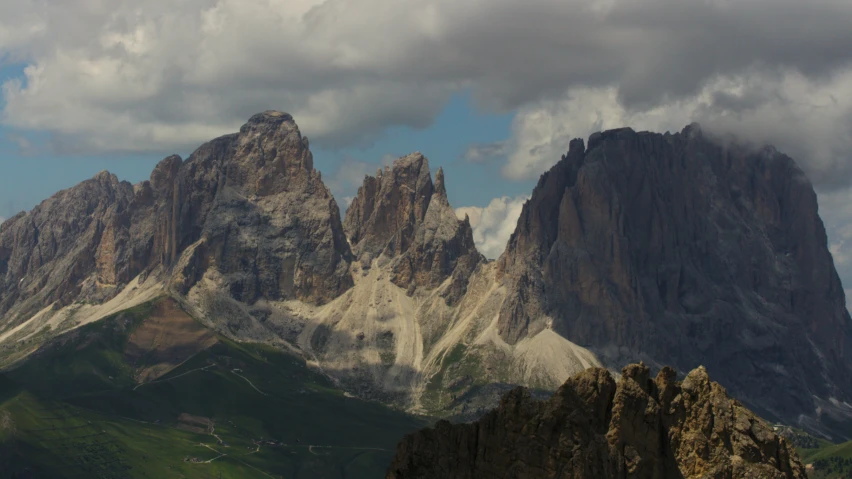 mountains rise from the ground on a cloudy day