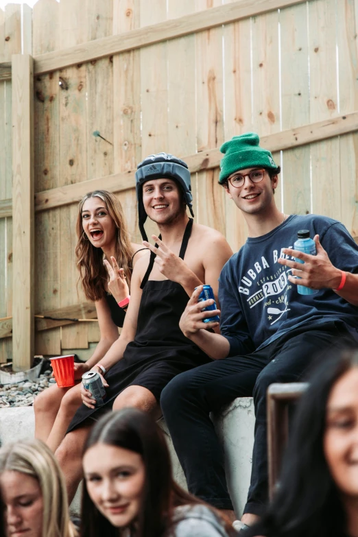 four friends sit and laugh in a group