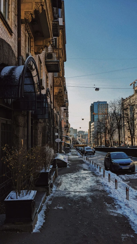 a very empty city street next to some buildings