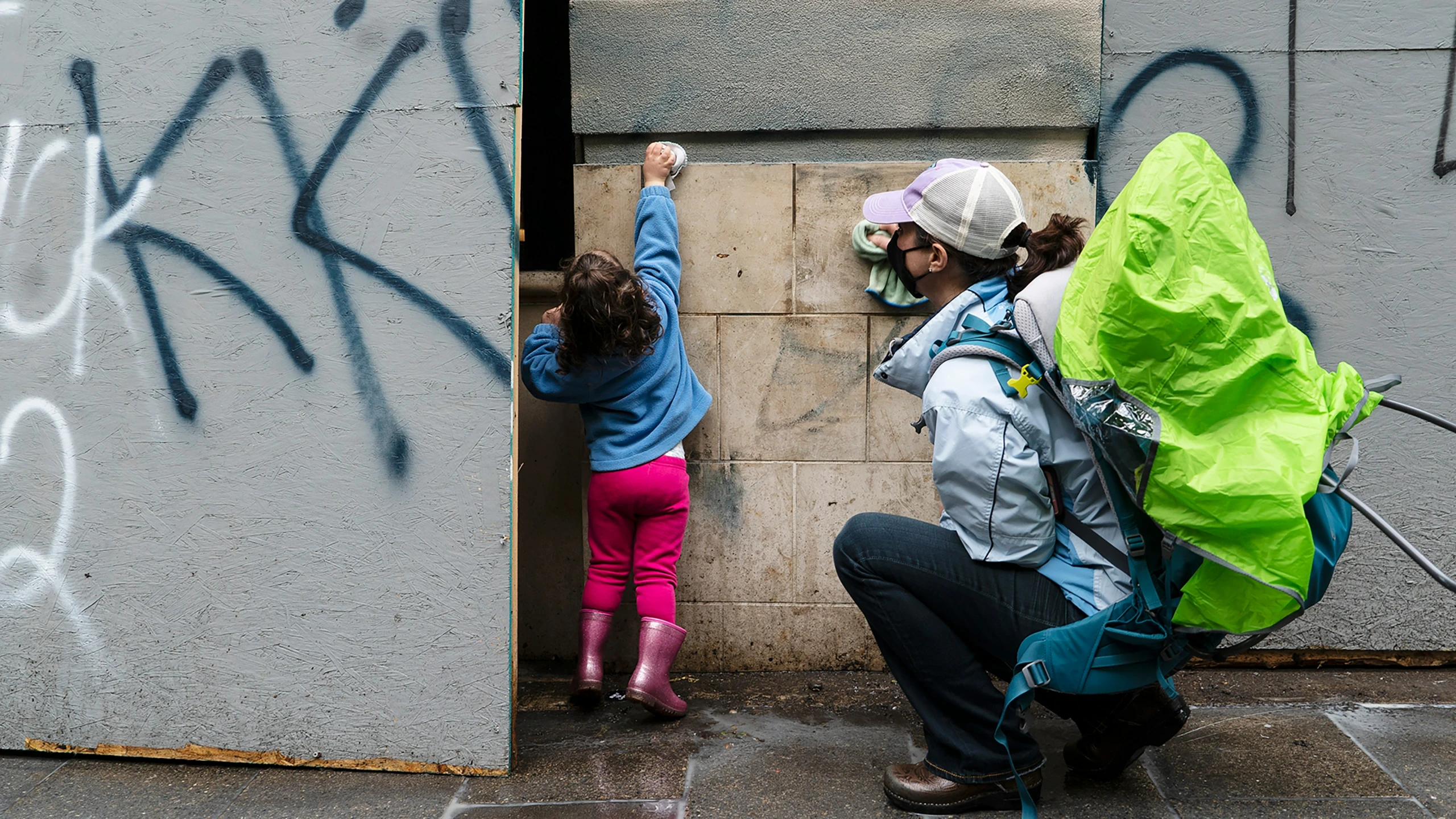 two s climb up and touch the wall