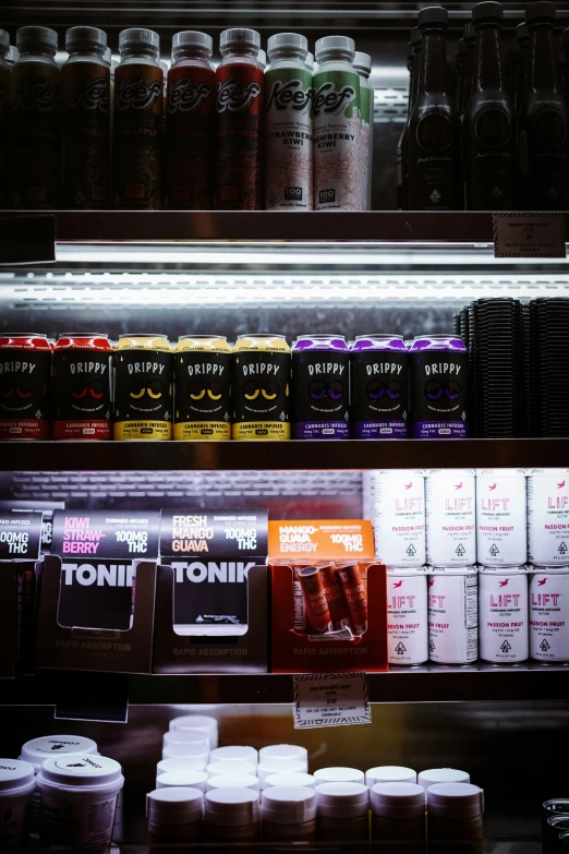 a shelf of drinks that is in a store