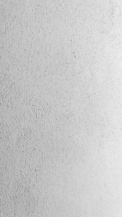 a picture of a white wall with dots in the air