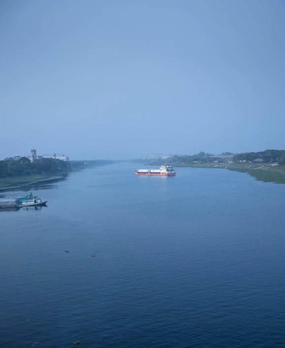 several boats traveling down a large body of water