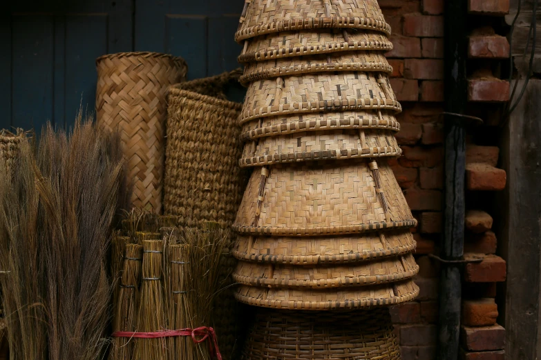 several types of baskets stacked on the floor