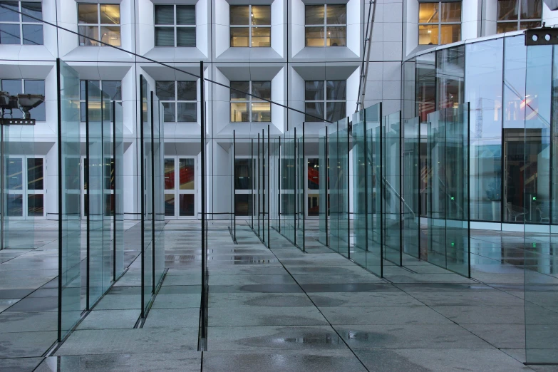 a room full of glass windows and windows next to some building