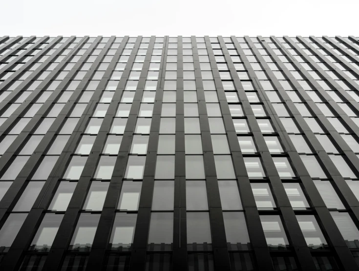 the window view of a large building from the street