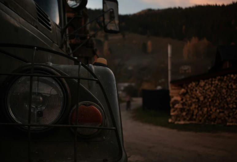 the back end of a truck with logs stacked on it