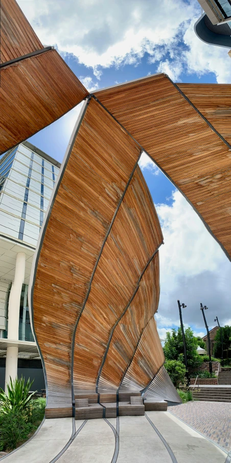 a large sculpture sits in the middle of a walkway