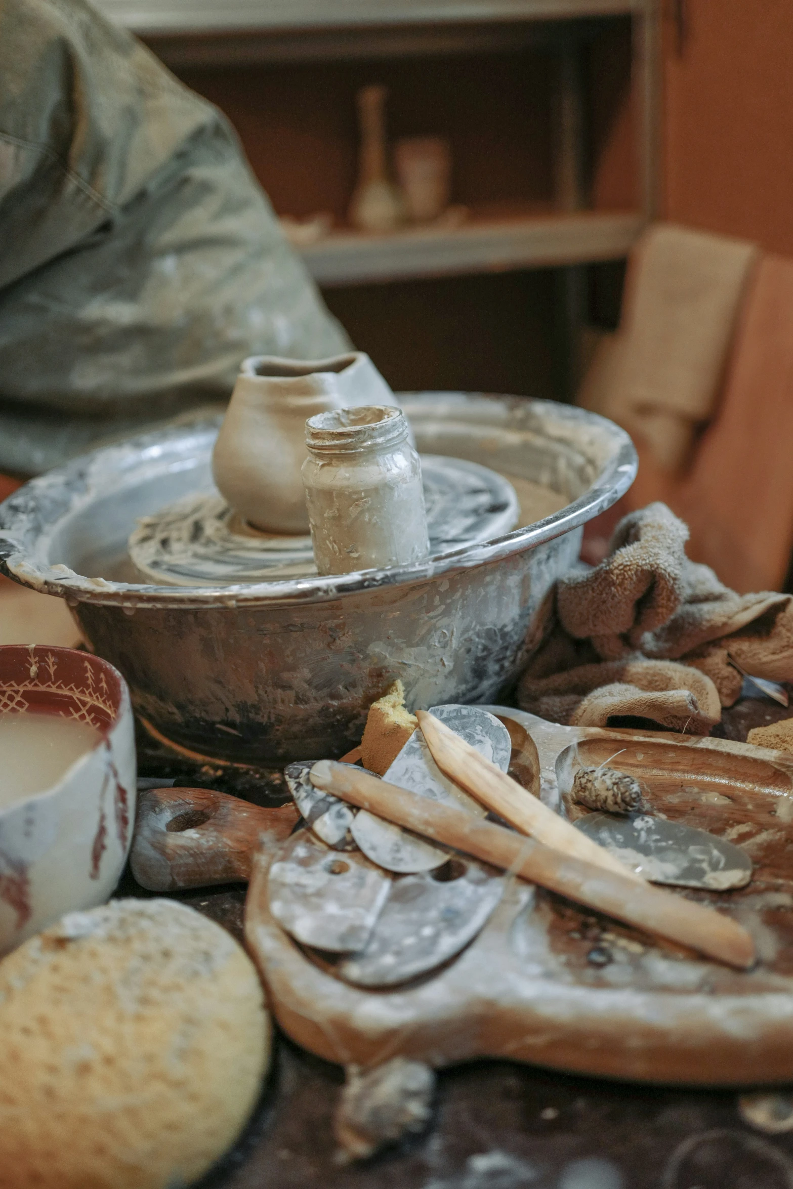 an old spinning wheel with two empty cups