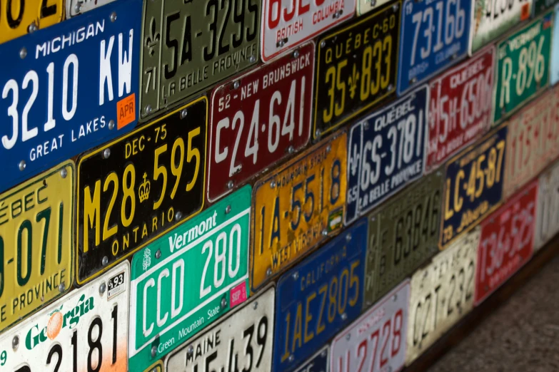 there is a large assortment of license plates on display