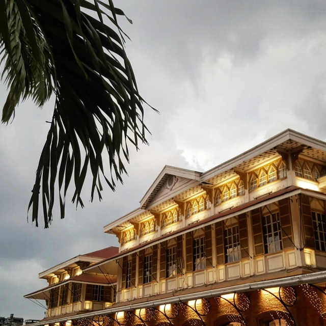 a view of a large brown and yellow building