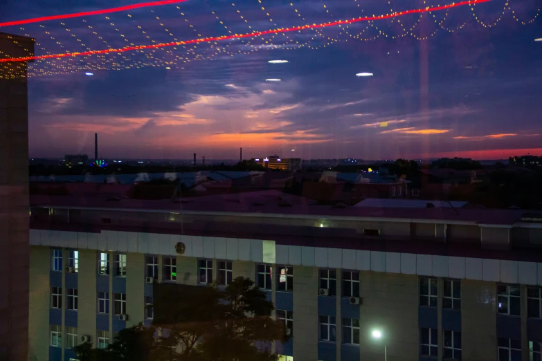 a large building with a long line of lights