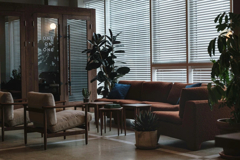 a lobby has wood slats and planters