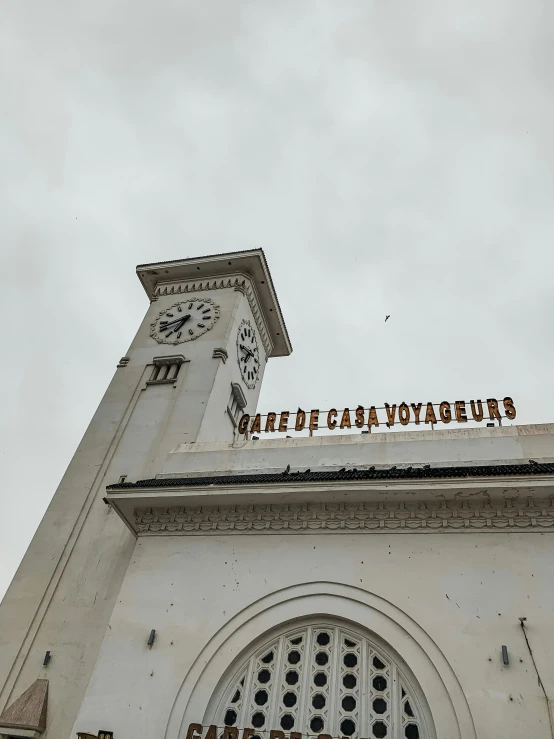 a tall building with a large clock tower on top