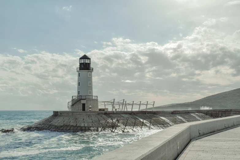 a light house is sitting on top of the pier