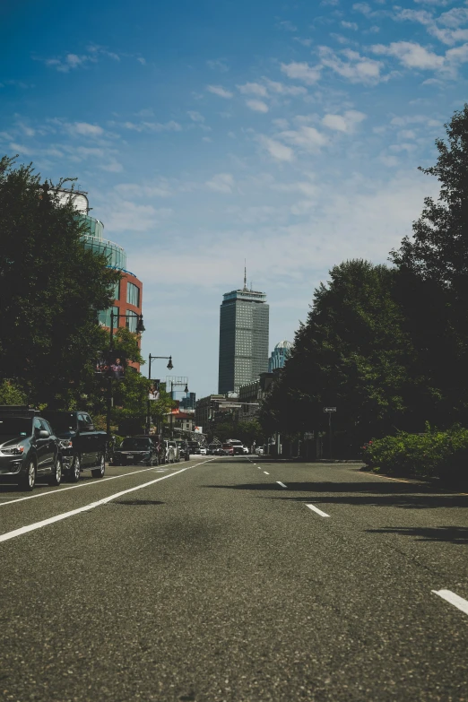 a busy street in a city with tall buildings