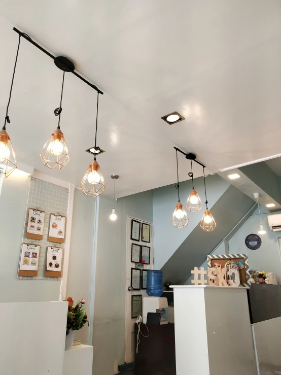 light bulbs are hanging from a ceiling in the kitchen