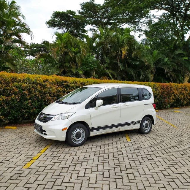 the white van is parked in the parking lot