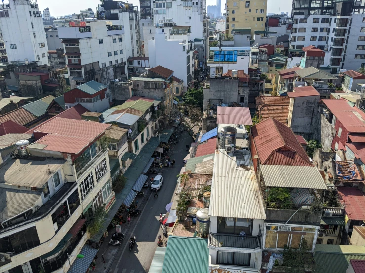 an aerial view of a city with buildings and tall structures