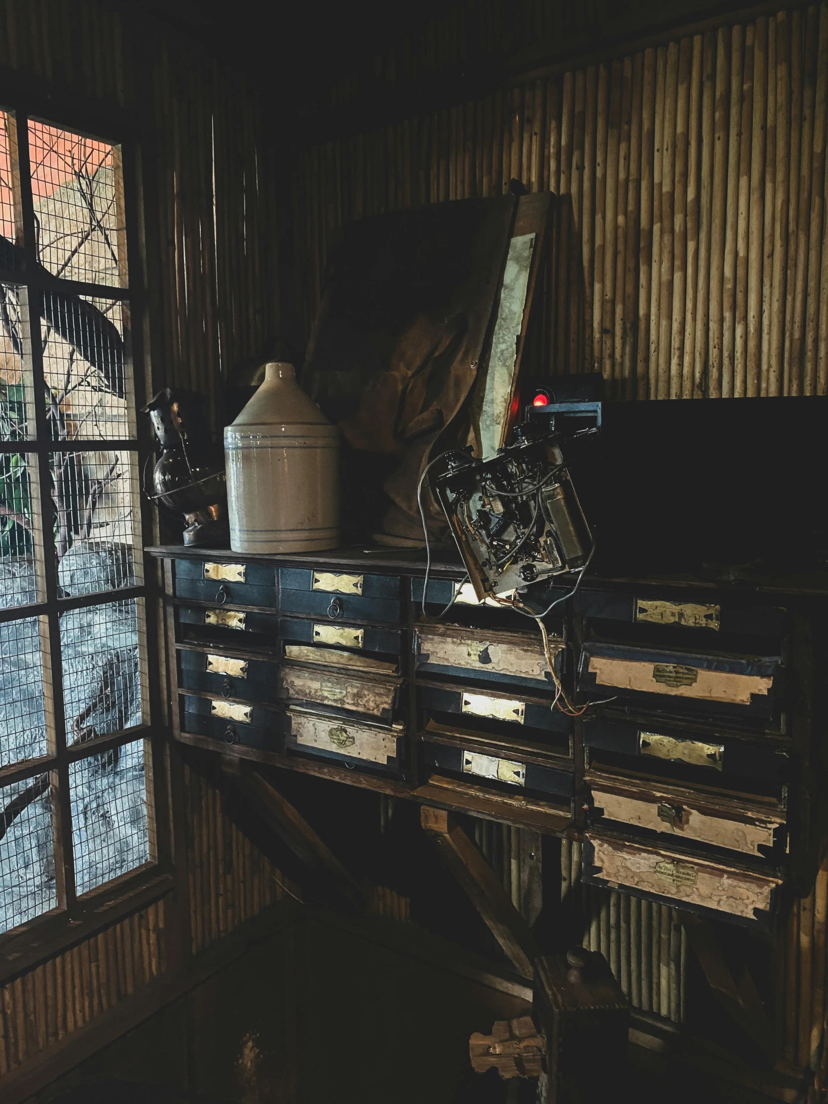 the inside of a building with a few boxes, and a camera