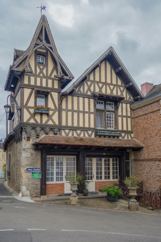 two houses built in a stone and timber architecture