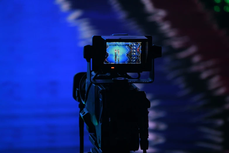 a camera is shown with a screen showing a show