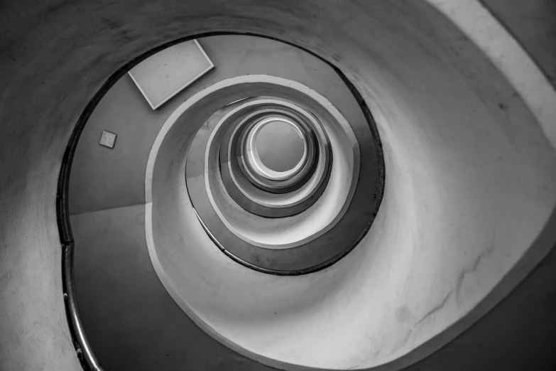 a black and white po of the inside of a spiral staircase