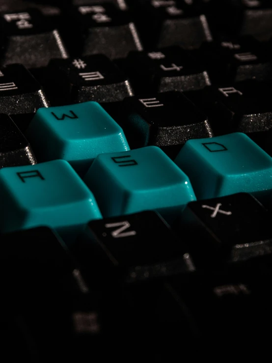 a black and green computer keyboard is illuminated