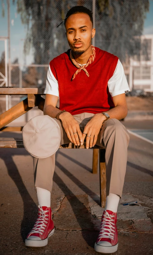 a person sitting in a chair with their feet crossed