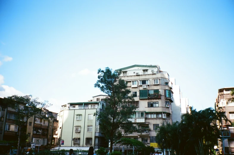 an apartment building with many balconies around it