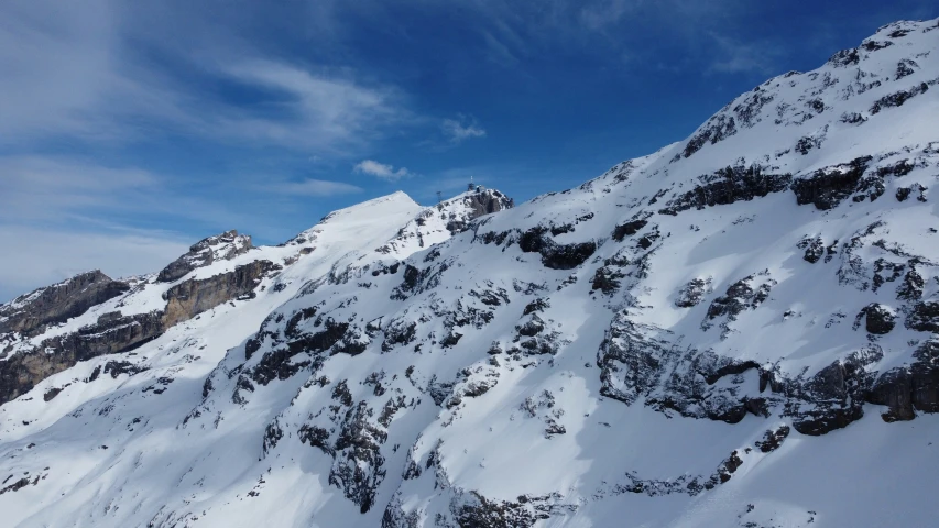 a very tall mountain covered in lots of snow