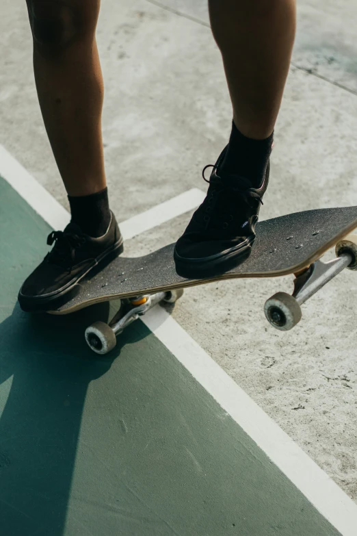 a close up view of someone's feet on a skateboard