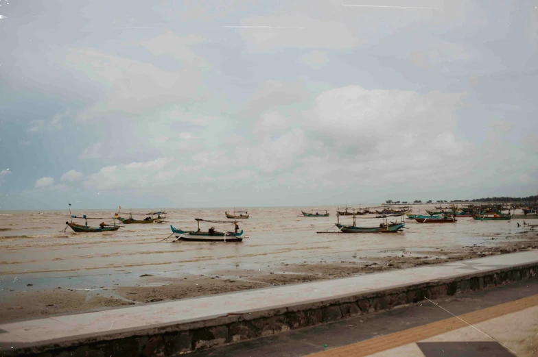 a group of boats floating on top of a river