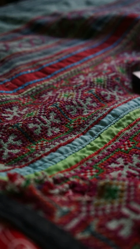 a cell phone laying on top of a rug