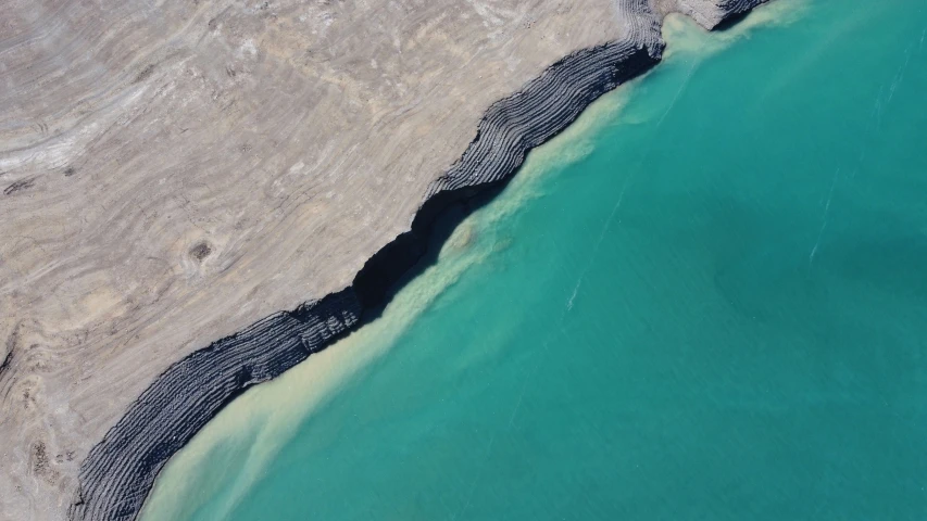 the ocean with blue water from a plane