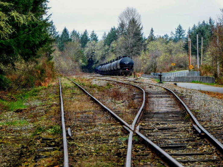 an image of an old train running along the tracks