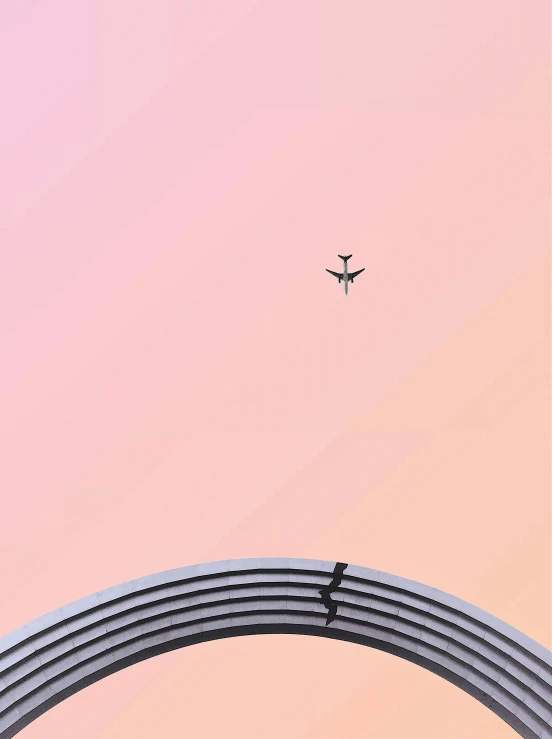 a plane flying through the sky from above an airport