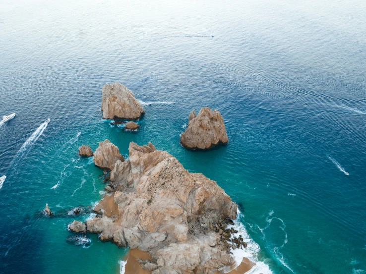 there are boats in the water at this beach