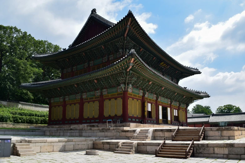 a pagoda stands in the middle of an outdoor courtyard