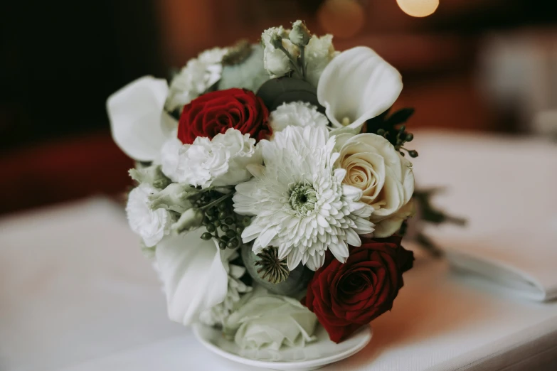 there is a bouquet of flowers on the table