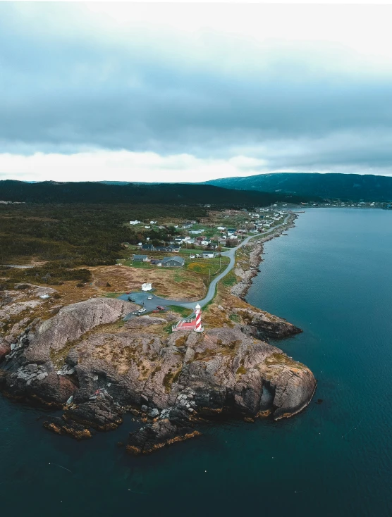 a small town near the water next to a shore