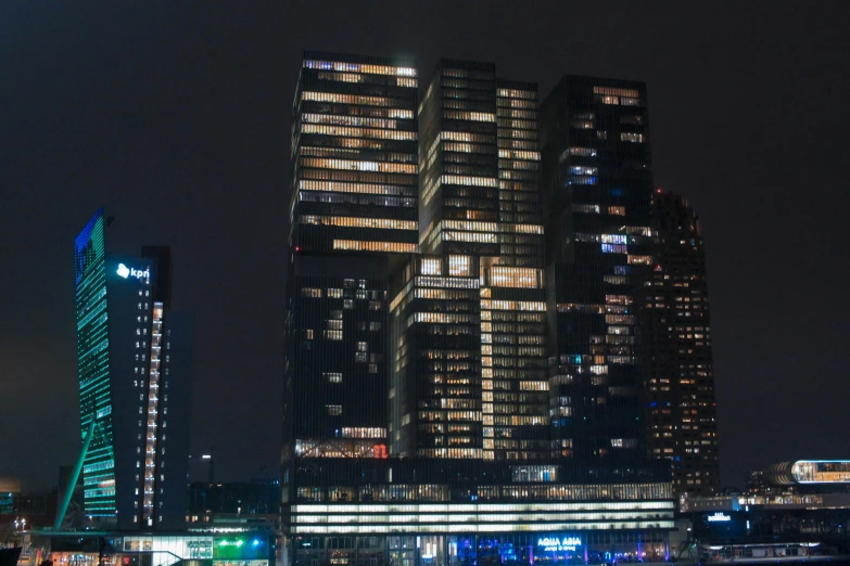 a large modern building stands alone in the city